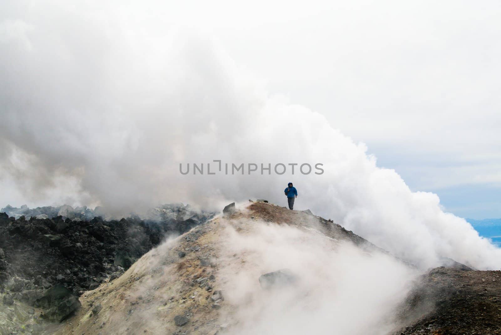 The Tourist on the top of volcano. Kamchatka