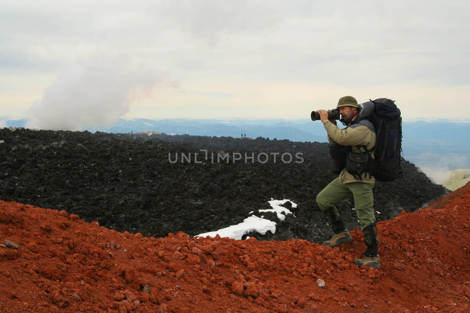 Kamchatka.Turist-photographer from the Avachinsky volcano crater.
