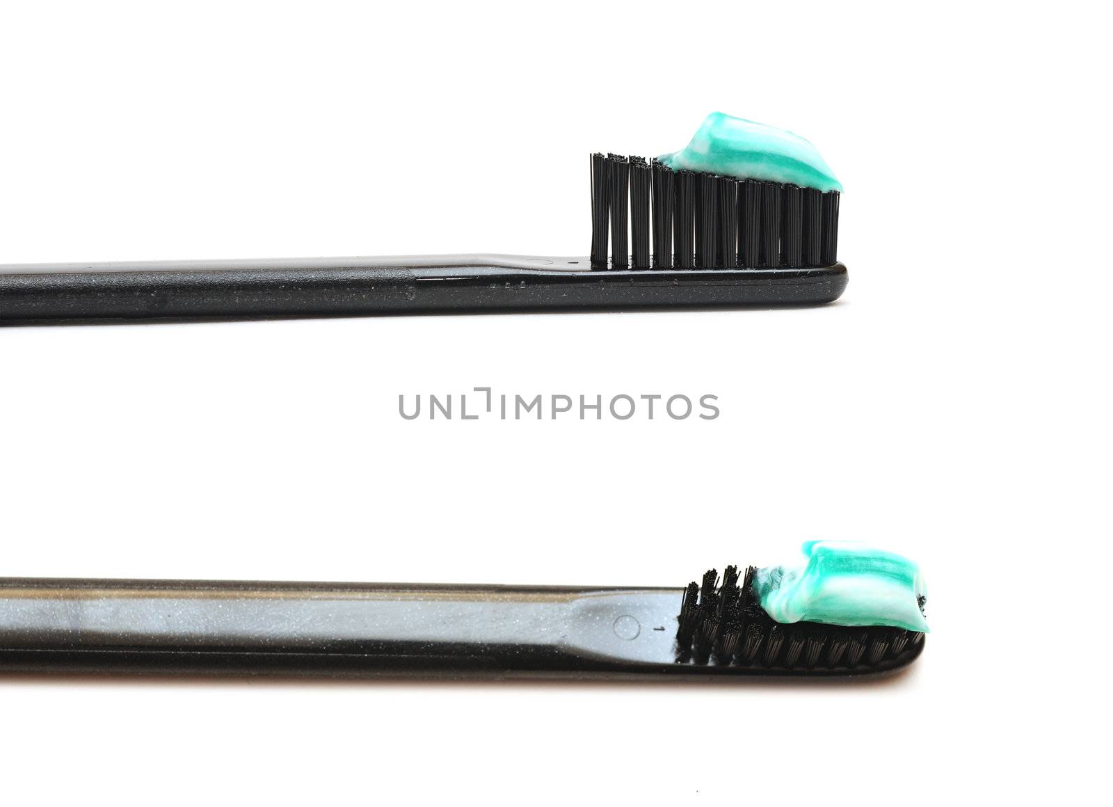 Close up toothbrushes over white background