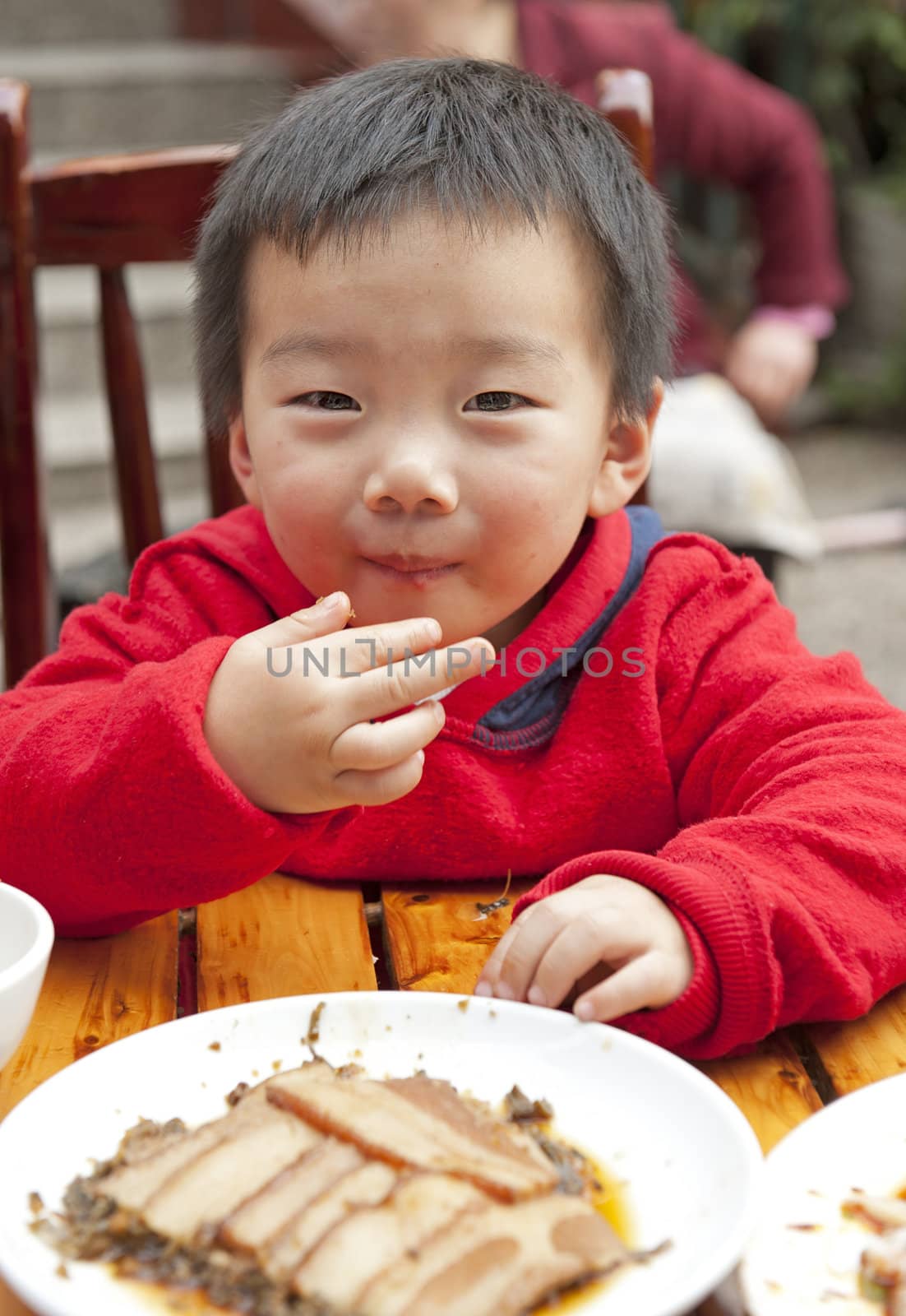 a cute baby is eating