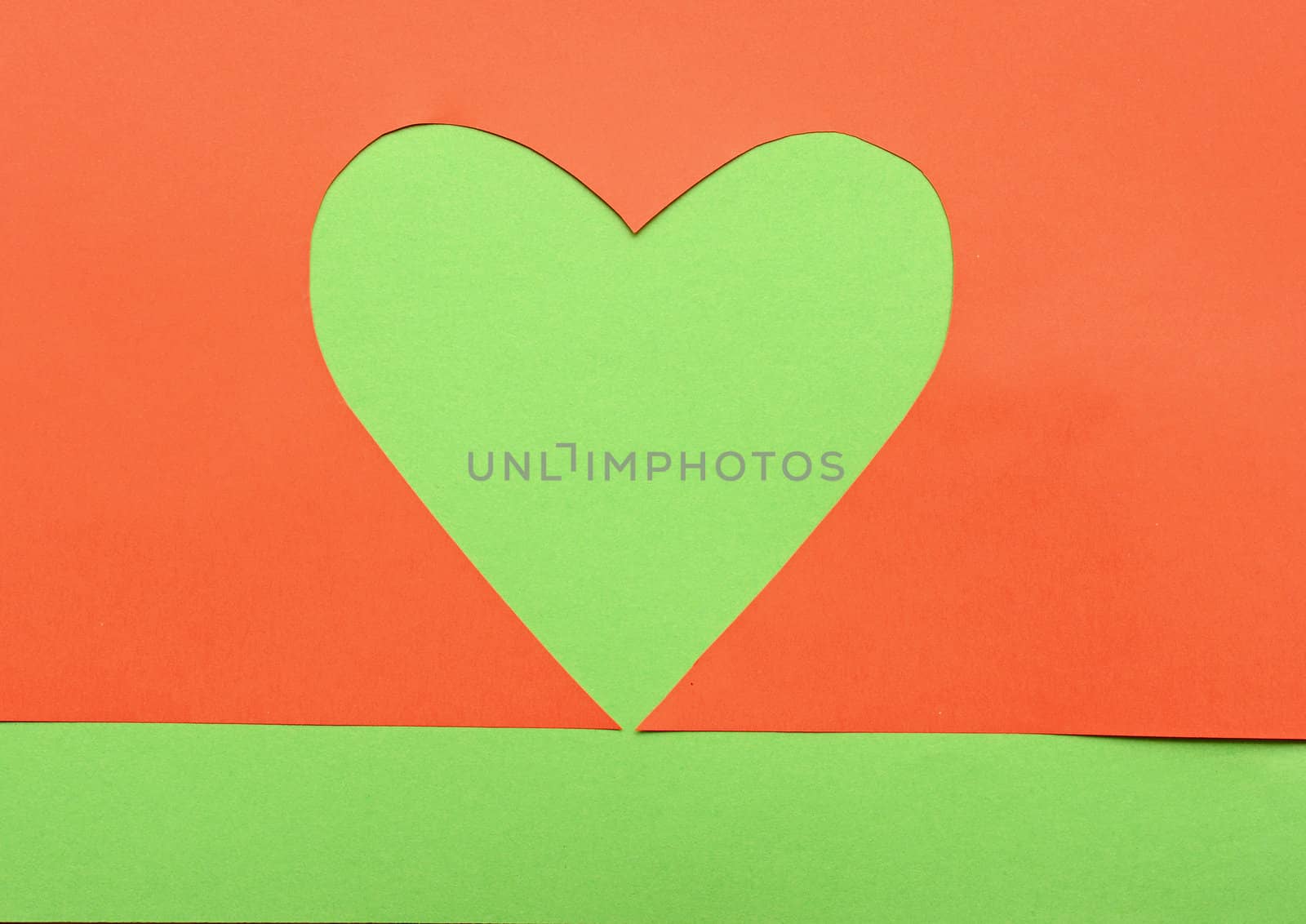 close up of paper heart shapes on green background by inxti