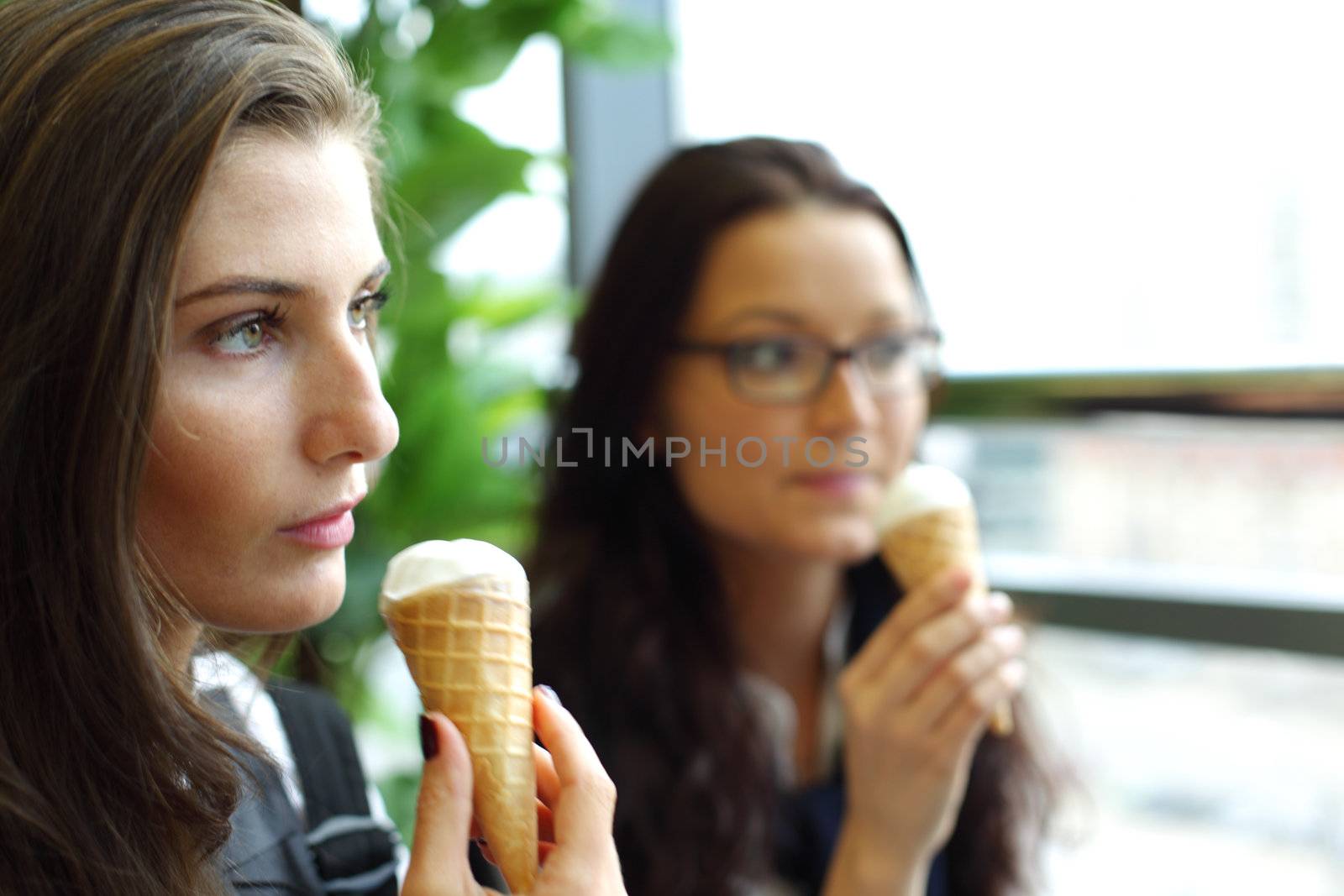 happy women licking ice cream  by Yellowj