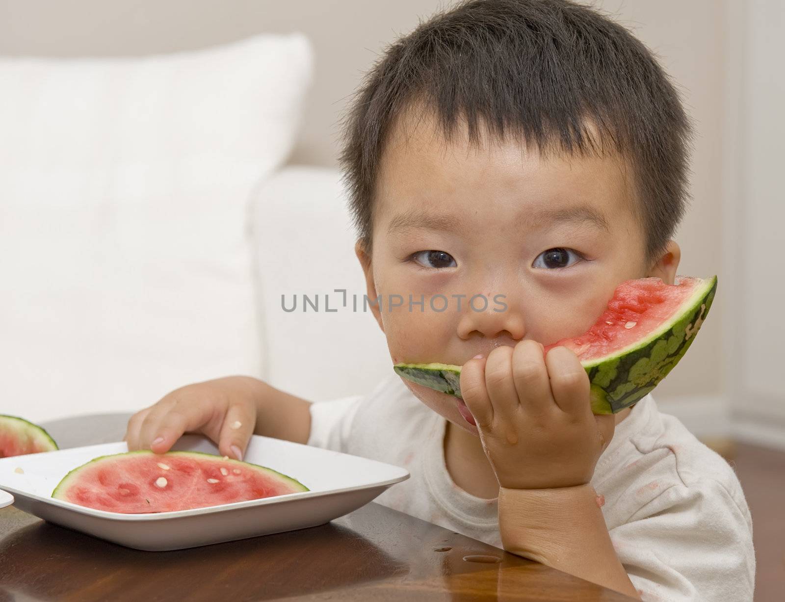 baby eating watermelon