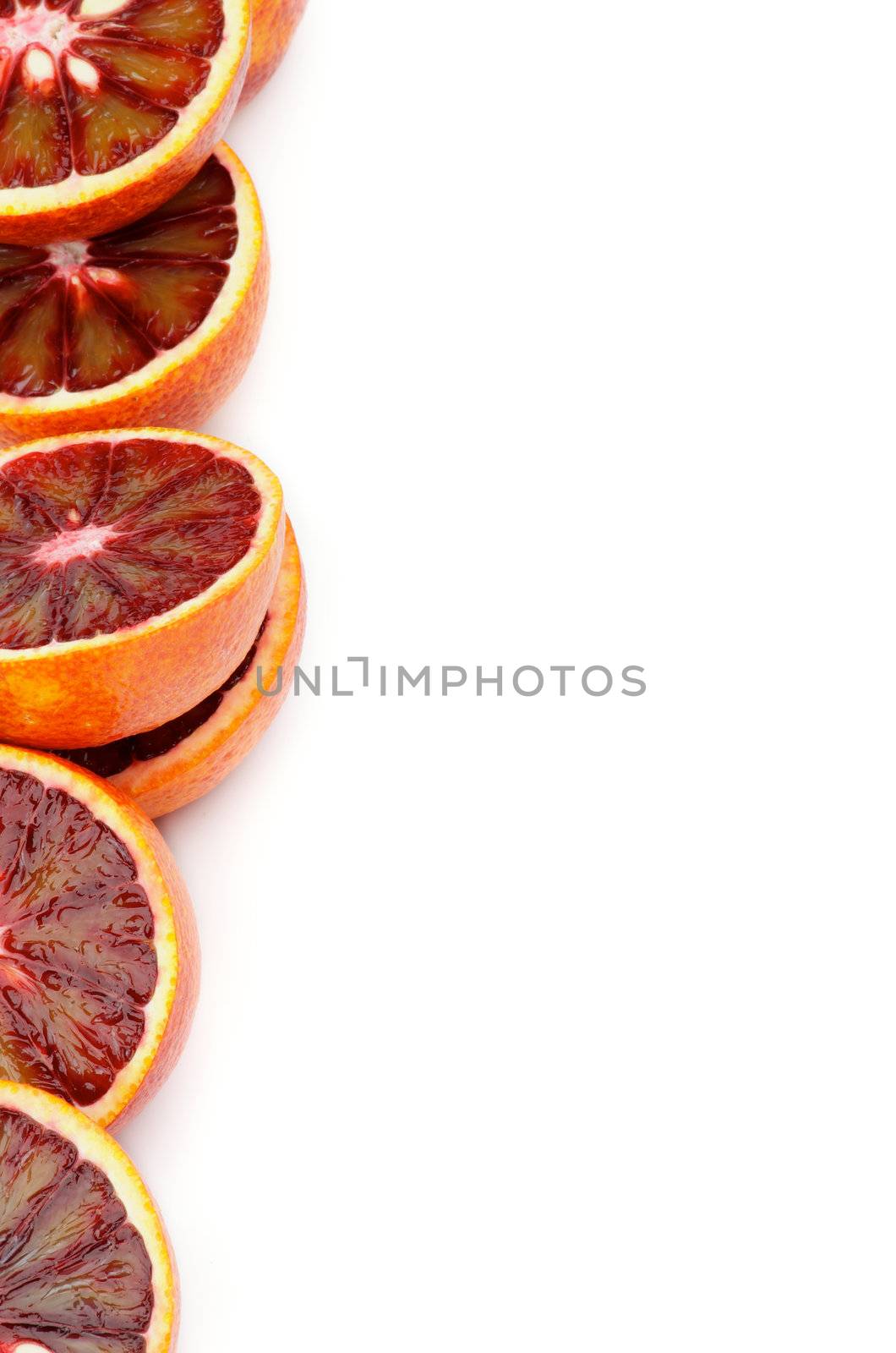Halves of Perfect Ripe Blood Oranges as Frame closeup on white background