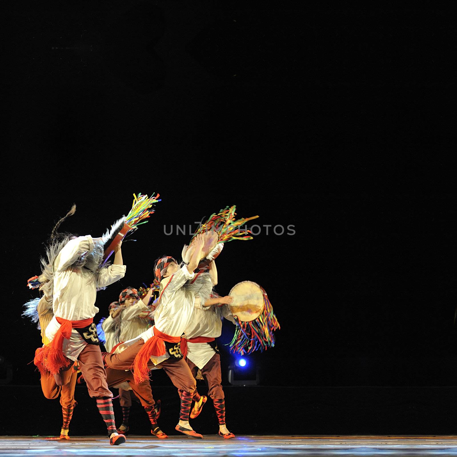 CHENGDU - SEP 28: chinese Qiang ethnic dancers perform on stage at Sichuan experimental theater.Sep 28,2010 in Chengdu, China.