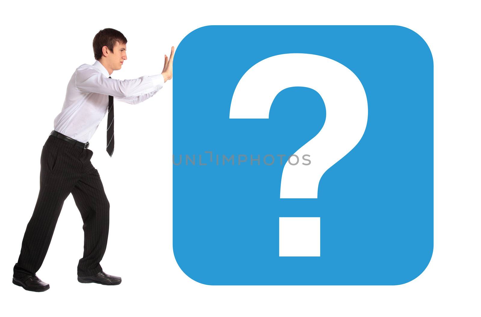 A young business man pushing a huge question mark. All isolated on white background.