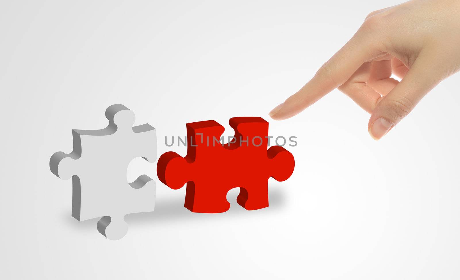 A person connecting to pieces of a puzzle.