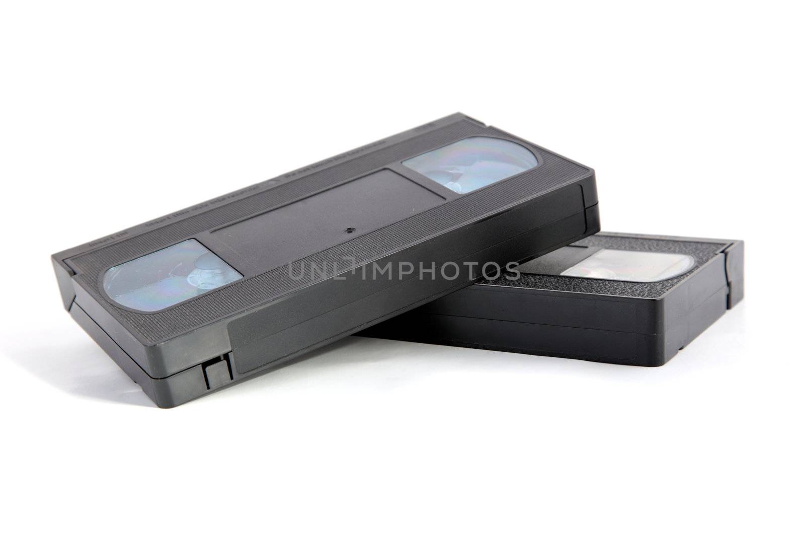 Old-fashioned VHS cassettes. All isolated on white background.