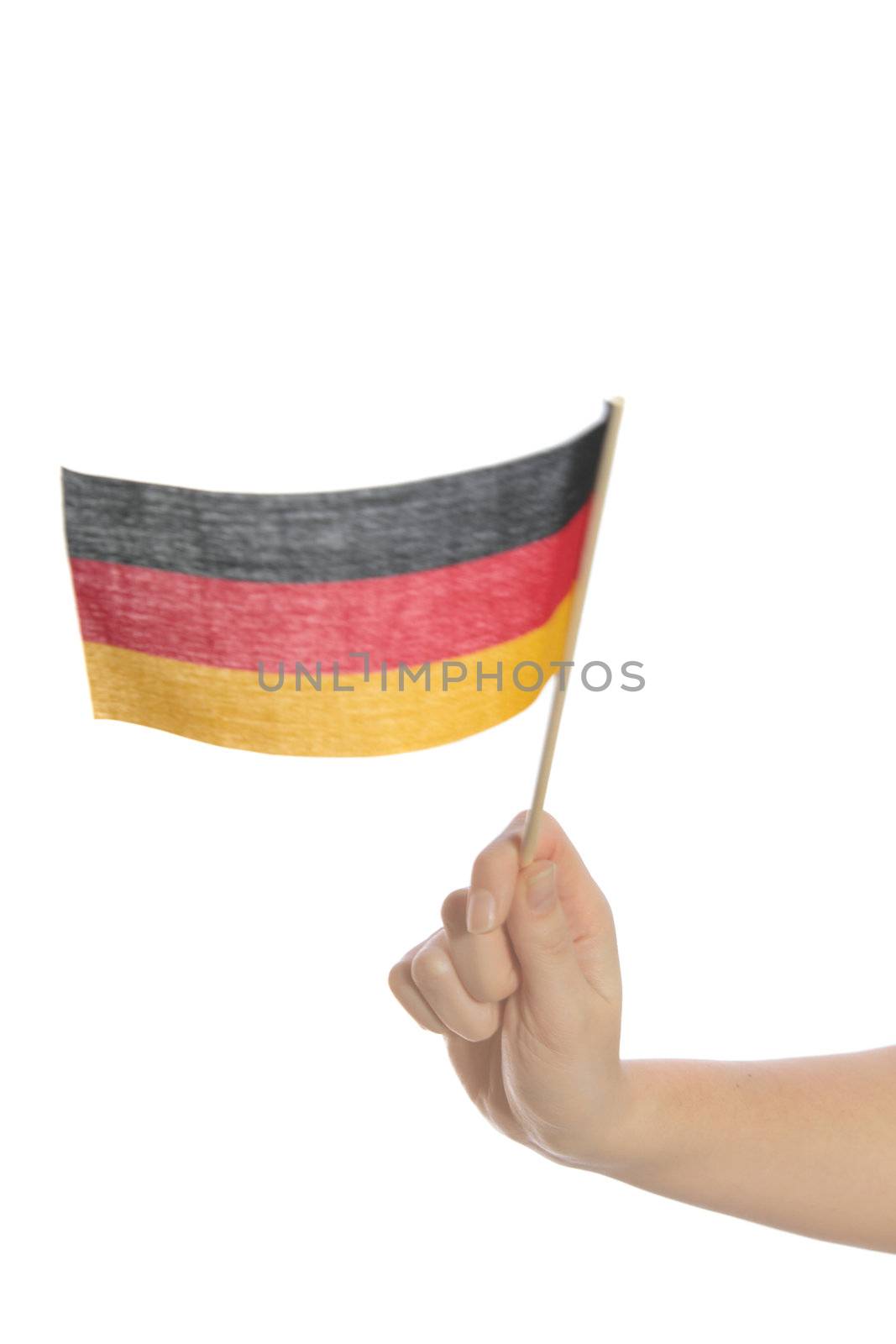 A human hand waves a german flag. All isolated on white background.