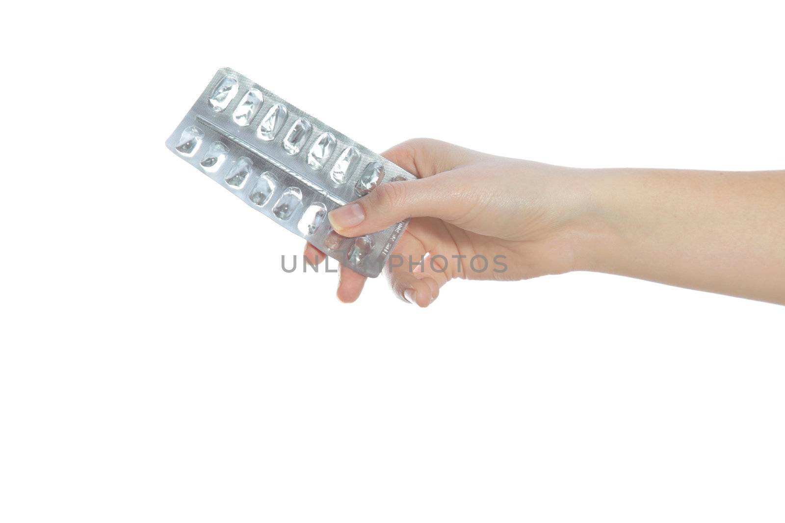 A human hand holding an empty medication packing. All isolated on white background