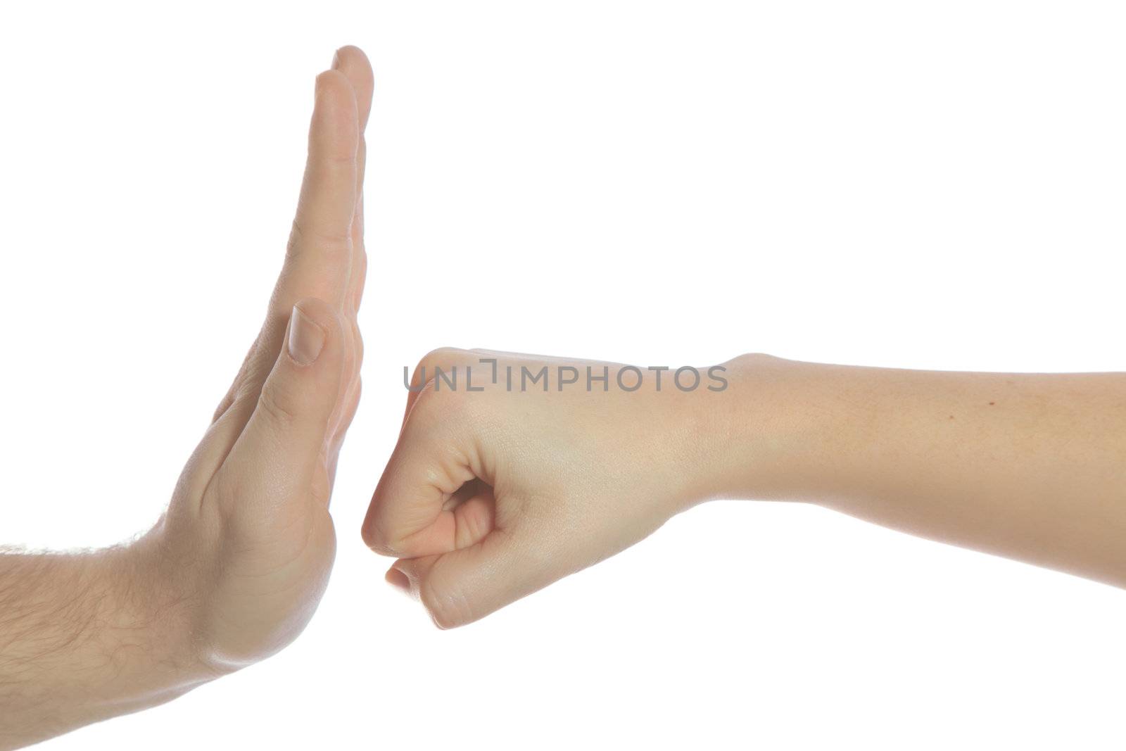 A human hand punching another hand. All isolated on white background.