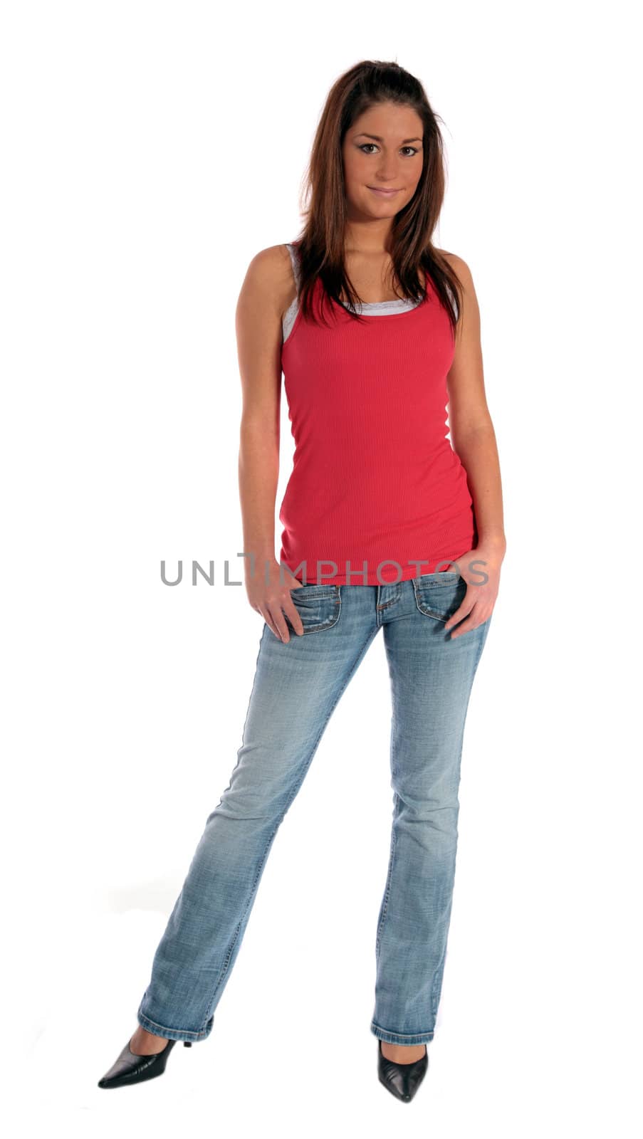 An attractive young woman standing in front of a plain white background.