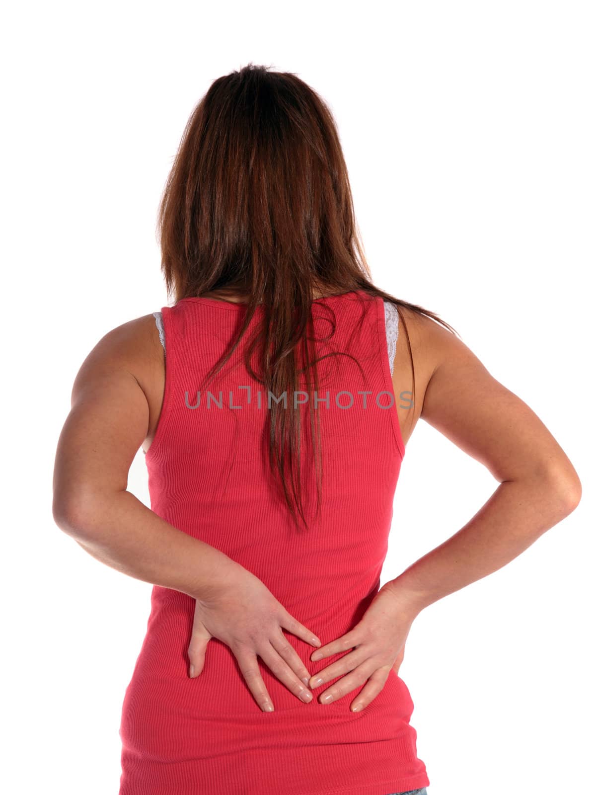 An attractive young woman suffering from backache. All isolated on white background.