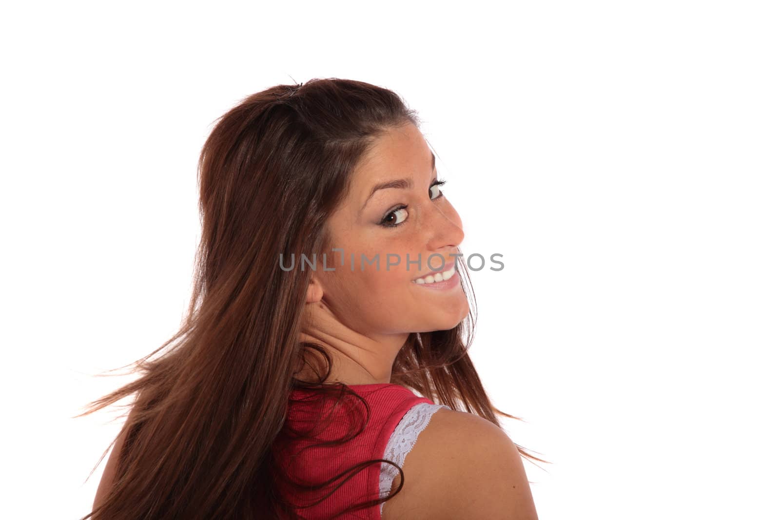 An attractive young woman looking behind. All isolated on white background.