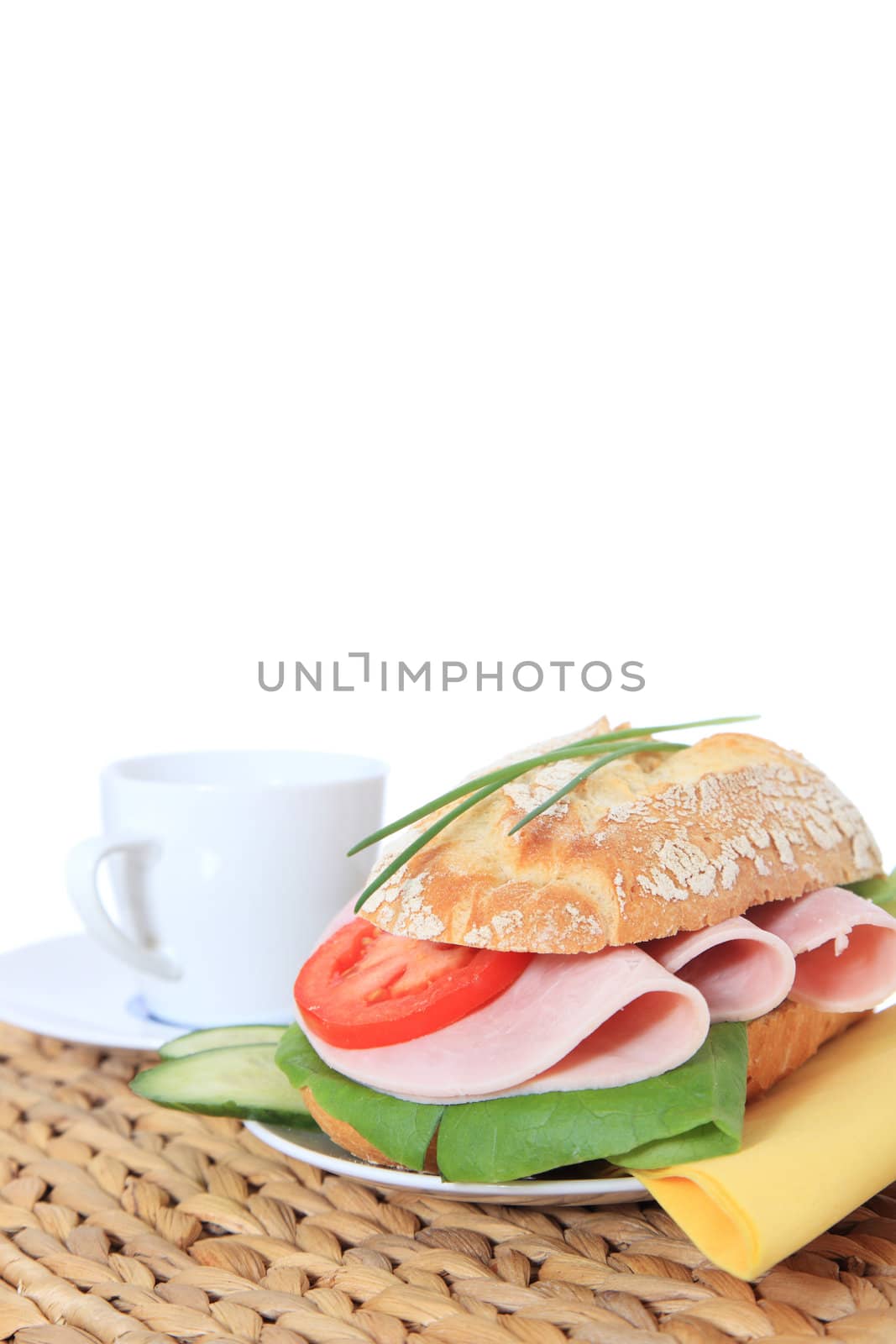 Fine served french roll with boiled ham. All on white background.