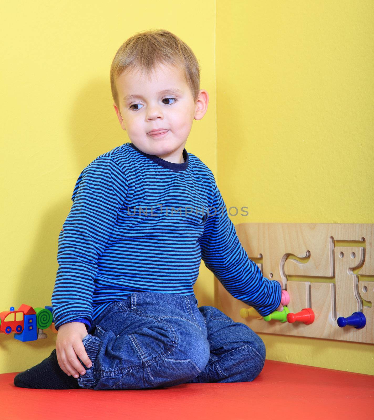 Cute european toddler in kindergarten.