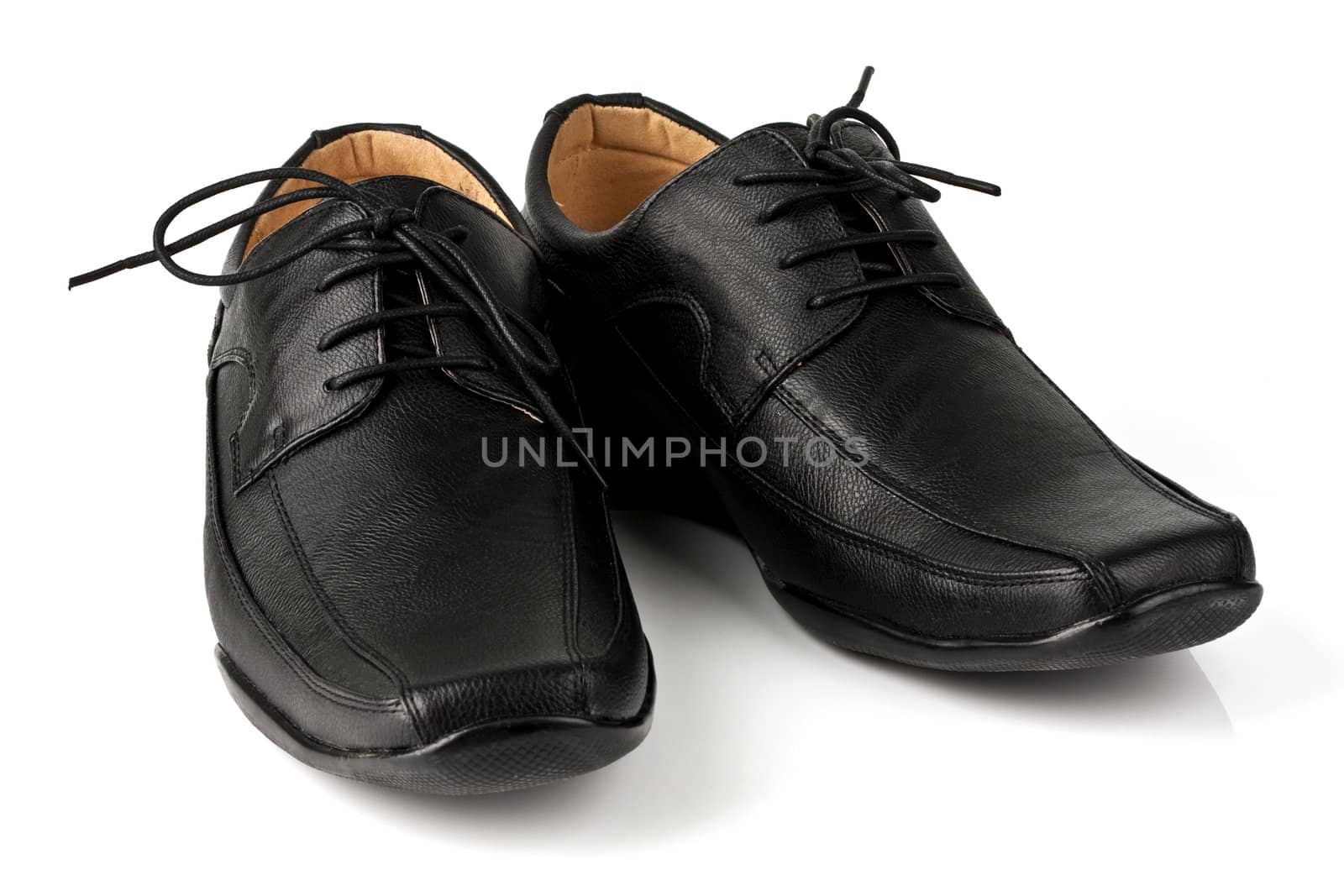 Elegant black leather men's shoes on white background with shadow.