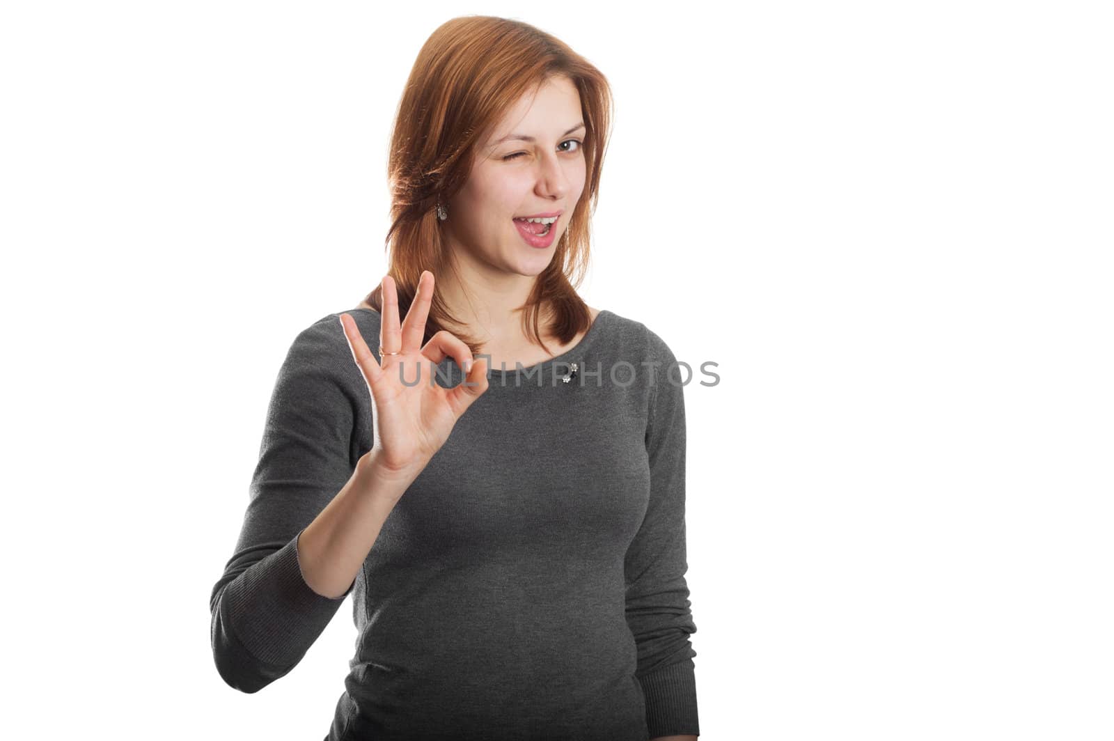 attractive girl showing okay gesture, isolated on white background
