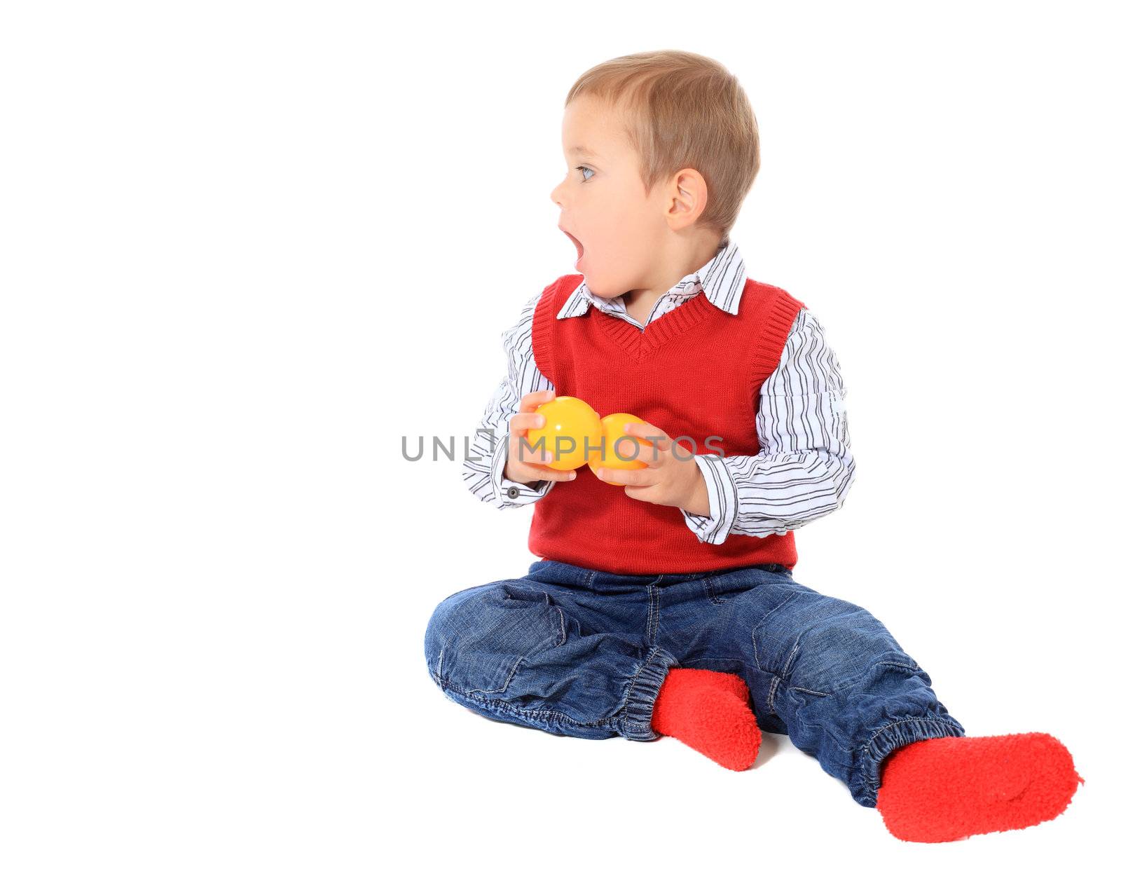 Cute caucasian toddler looking to the side. All on white background.