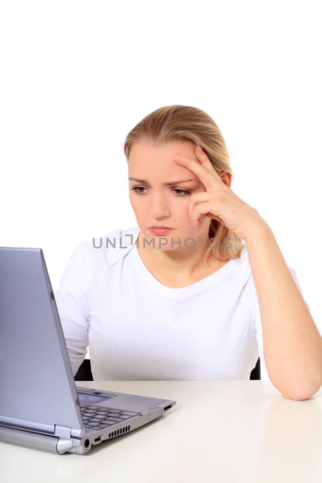 Attractive blond woman got a problem with her notebook computer. All on white background.