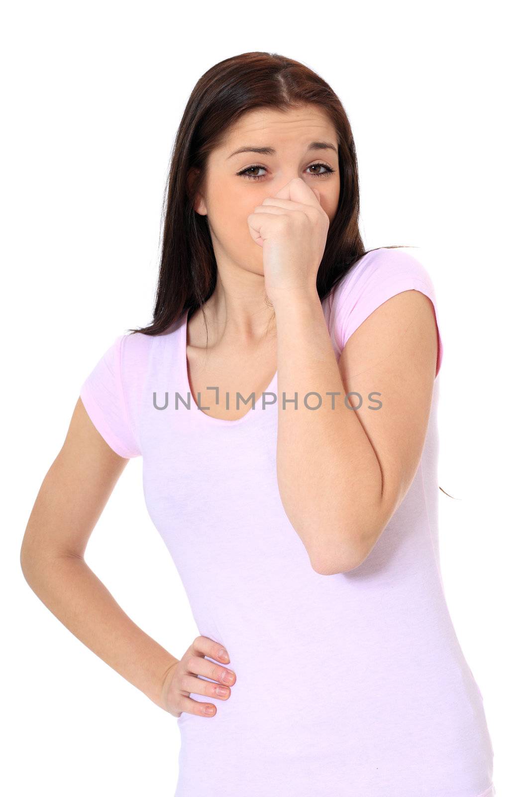 Attractive young scandinavian woman smells something. All on white background.