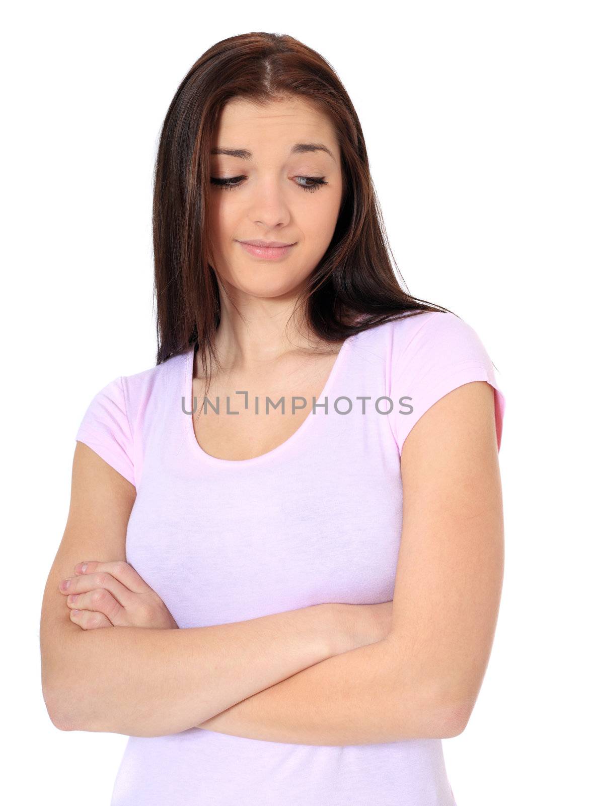 Attractive teenage girl with doubtful look. All on white background.