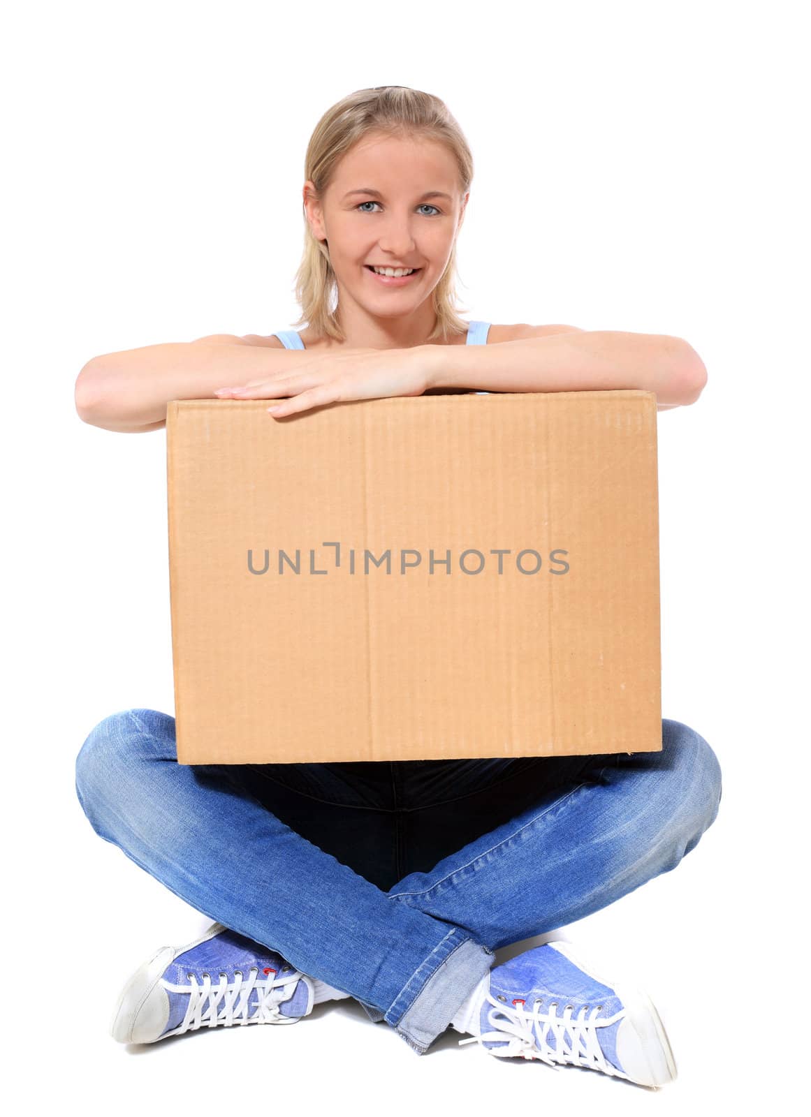 Attractive young scandinavian woman holding moving box. All on white background.