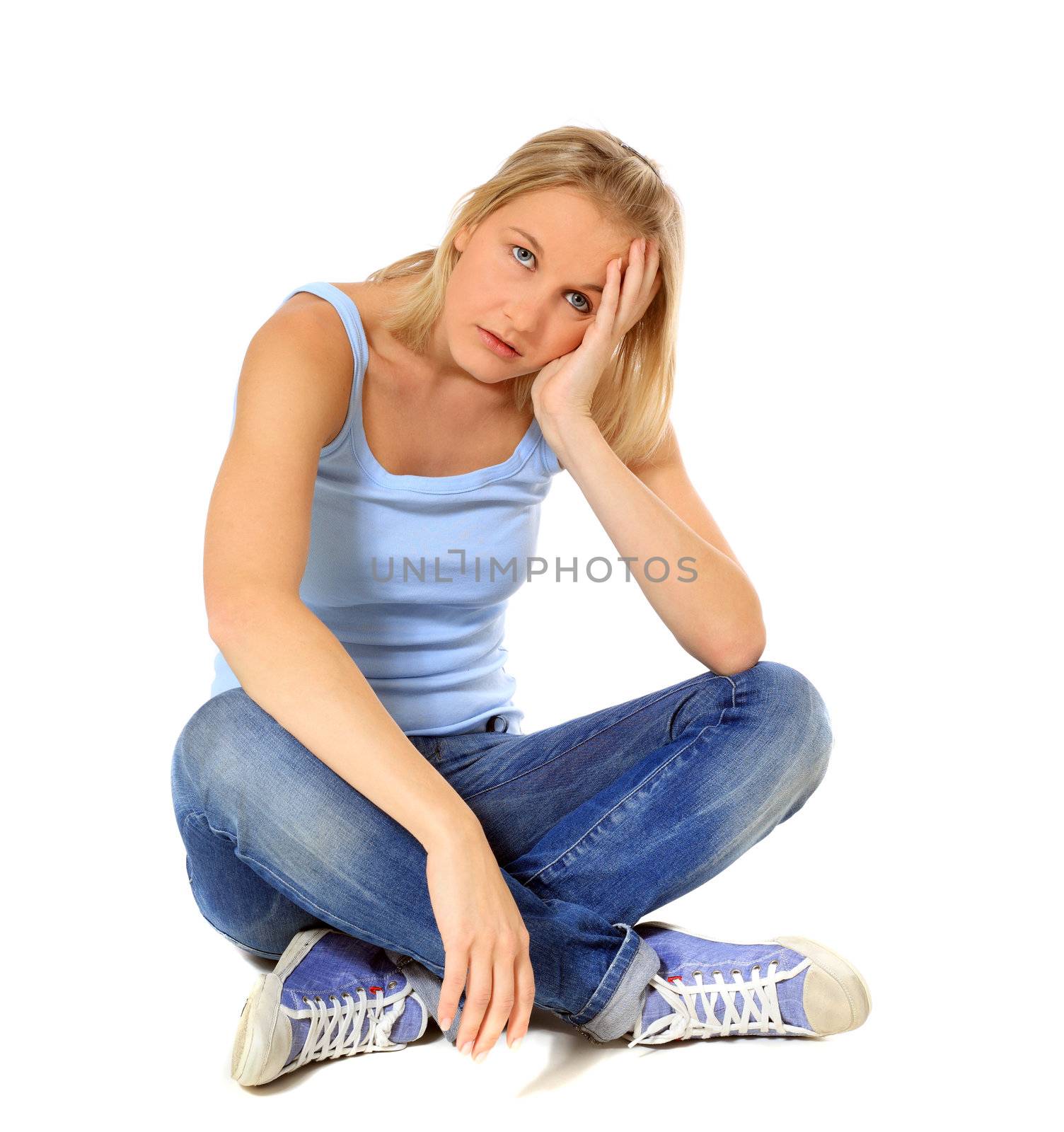 Frustrated scandinavian girl sitting on floor. All on white background.