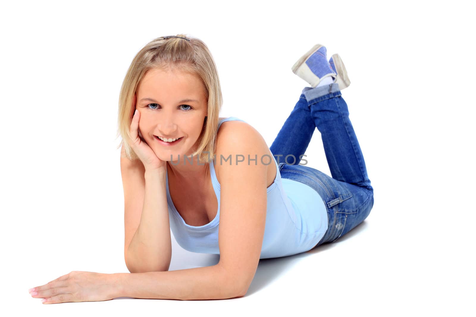 Attractive young scandinavian woman lying on the floor. All on white background.