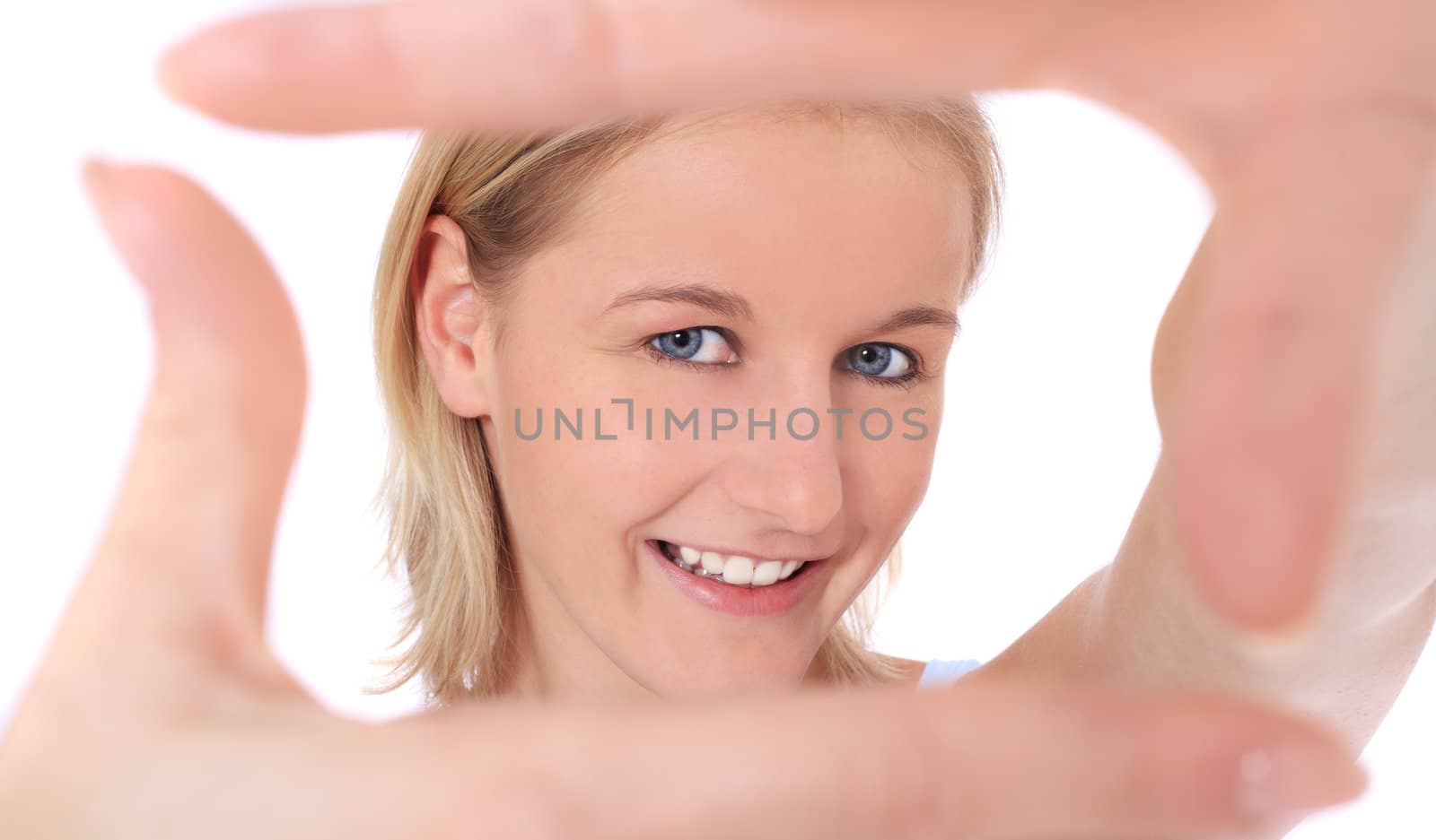 Attractive young scandinavian woman building a frame out of her hands. All on white background.