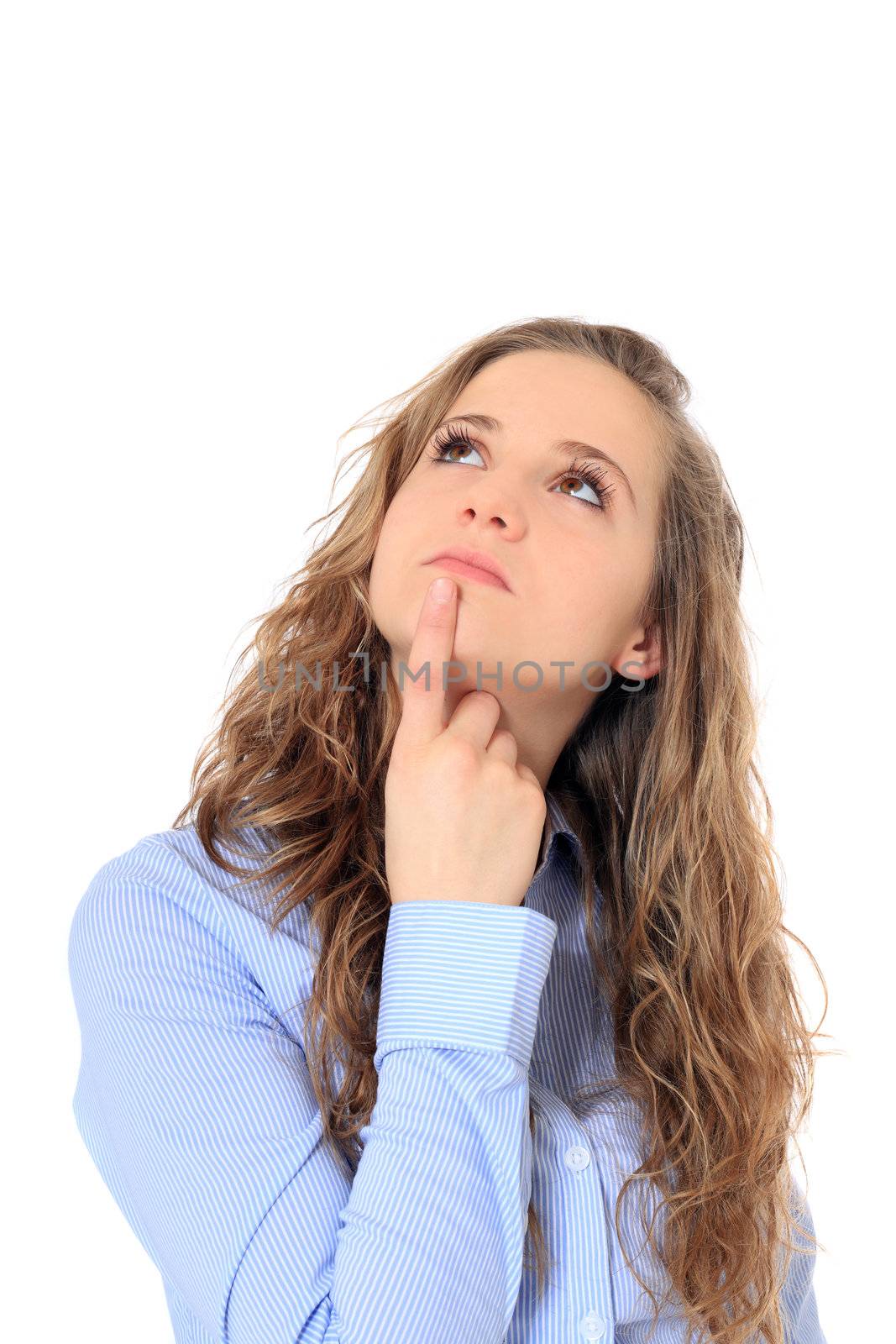 Attractive young girl delibaretes a decision. All on white background.