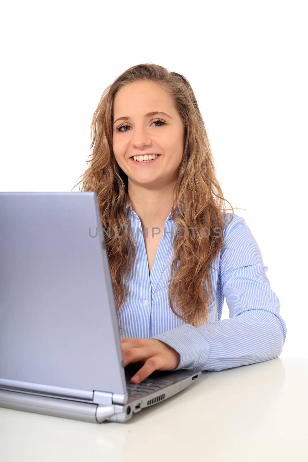 Portrait of an attractive young girl using notebook computer. All on white background.