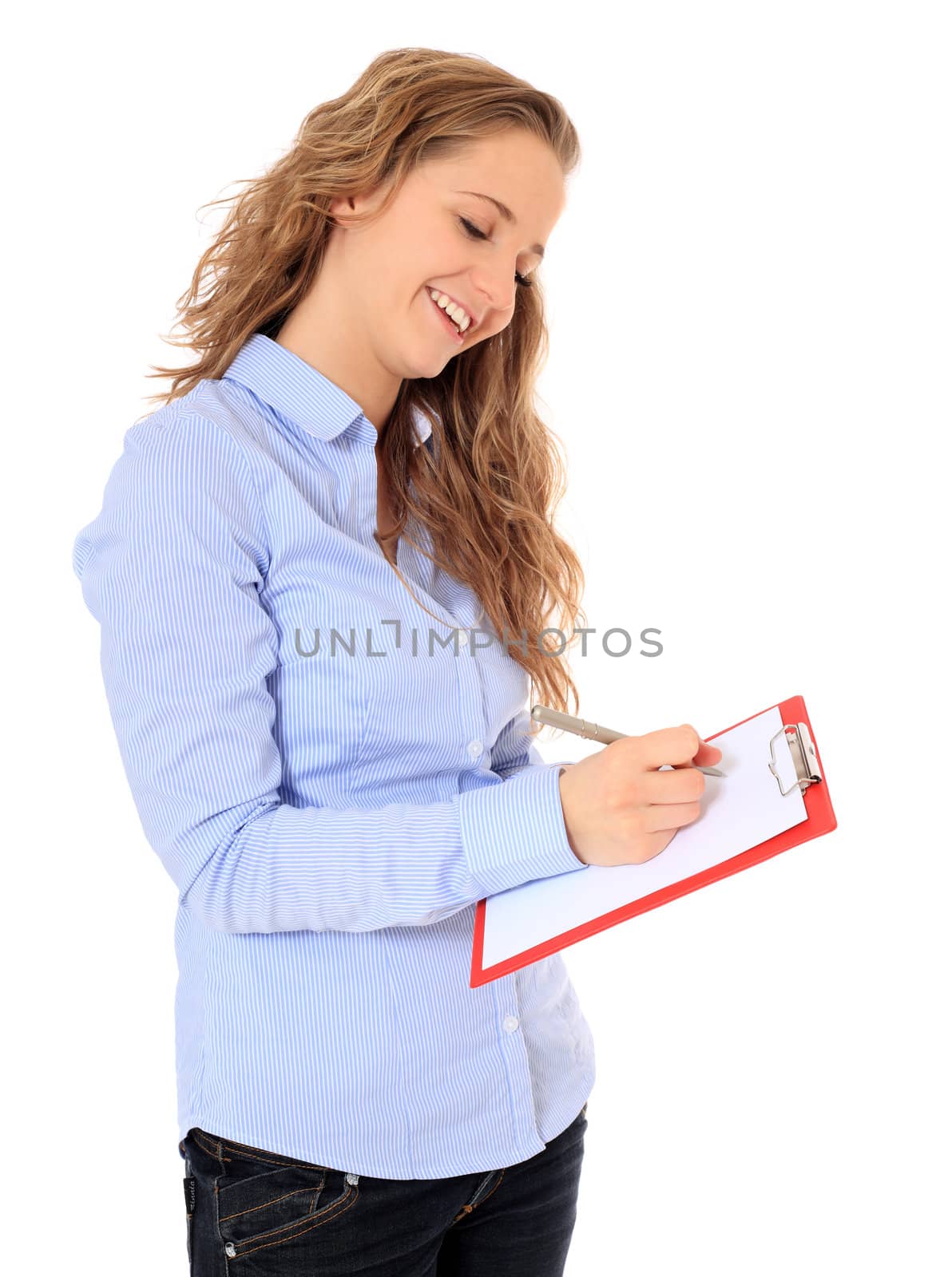 Portrait of an attractive young girl writing on a clipboard. All on white background.