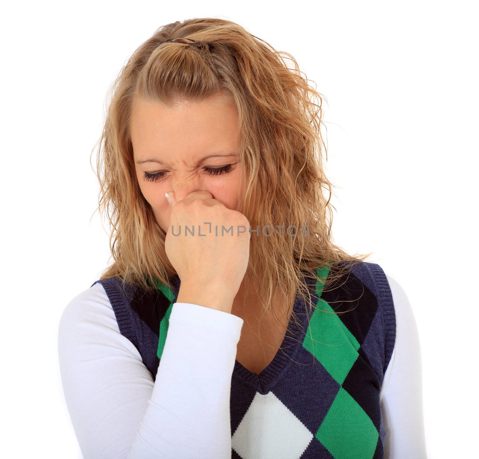 Attractive young woman sneezing. All on white background.