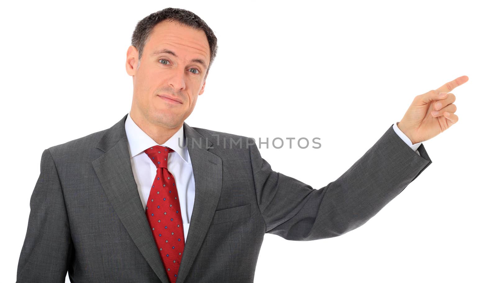 Attractive businessman pointing to the side. All on white background.