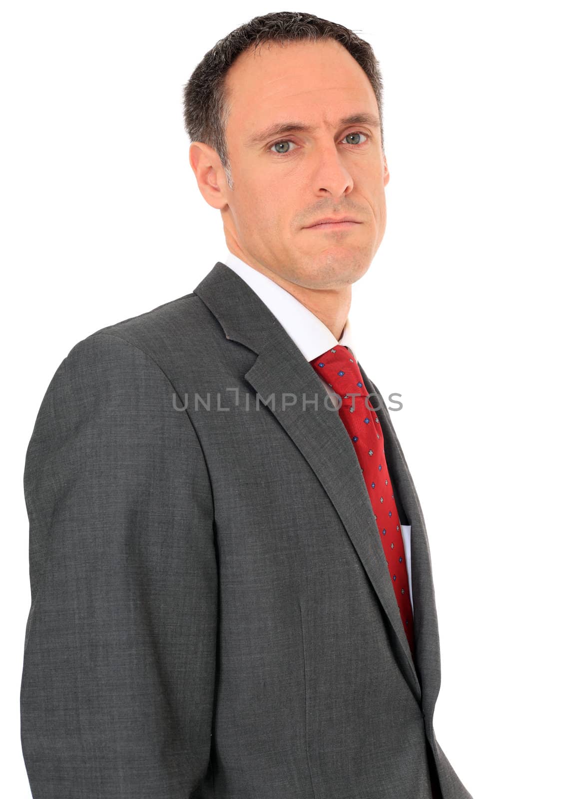 Serious looking businessman. All on white background.