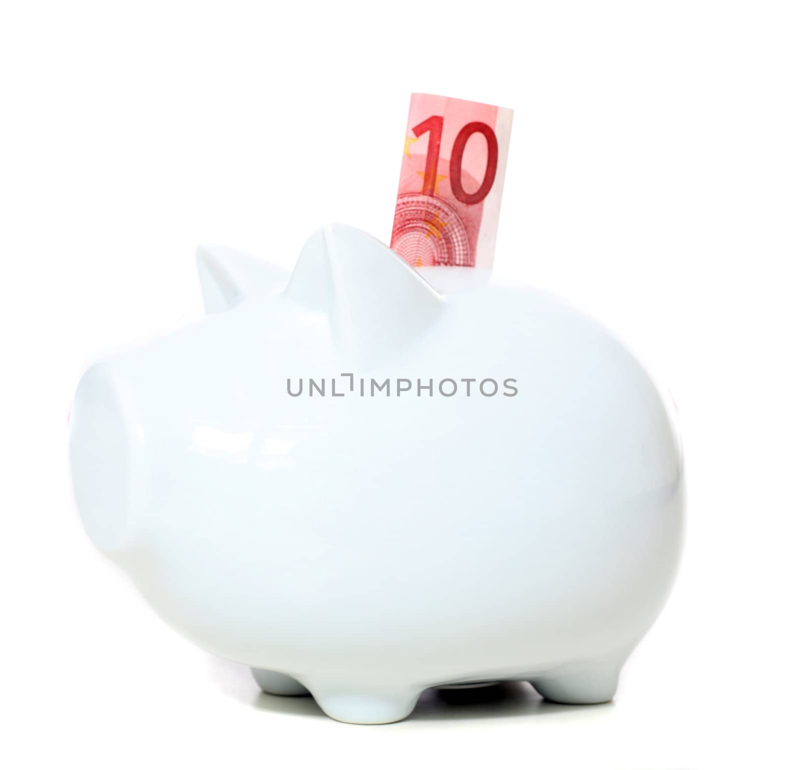 Piggy bank with 10 Euro note. All isolated on white background.