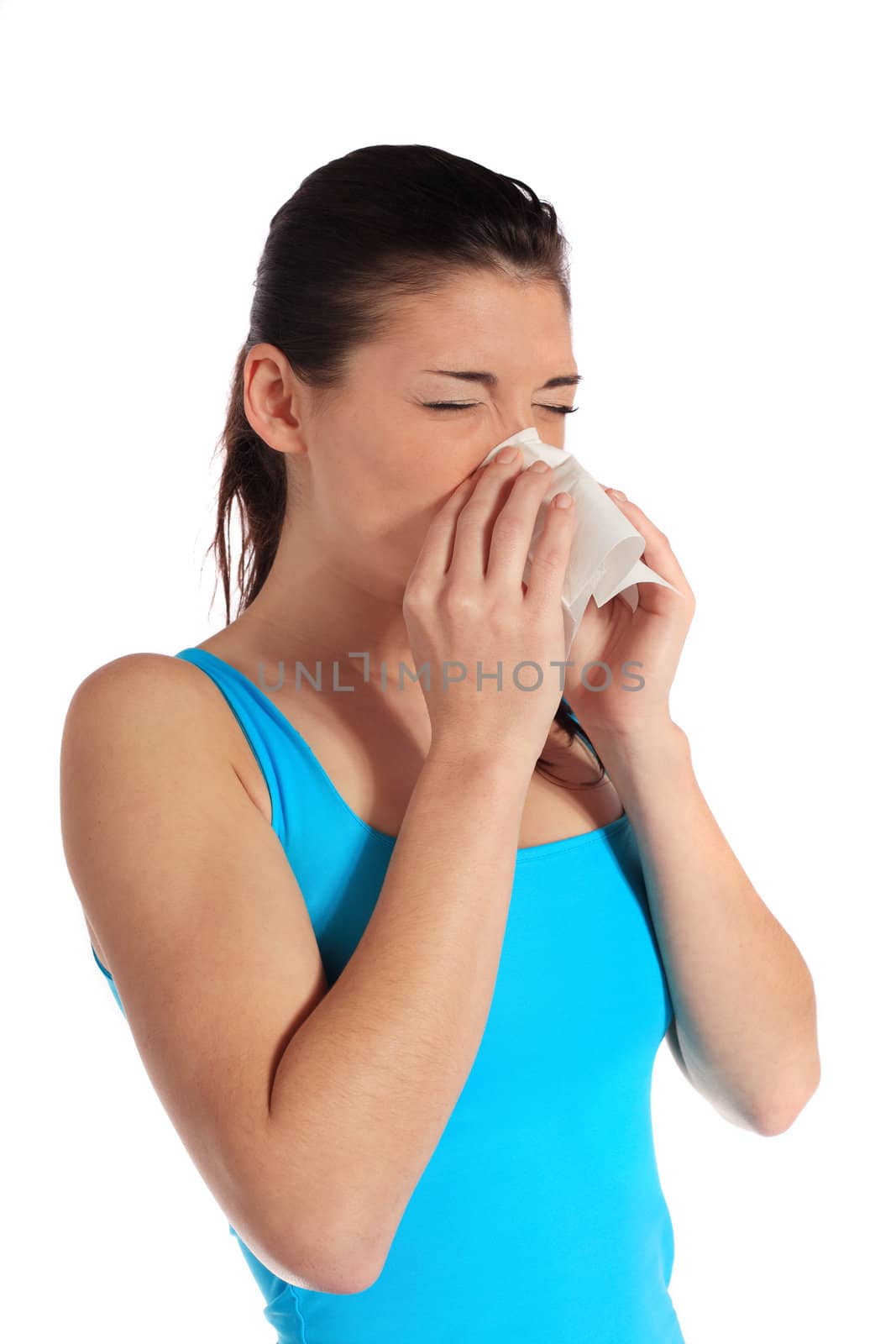Attractive young woman using a tissue. All on white background.