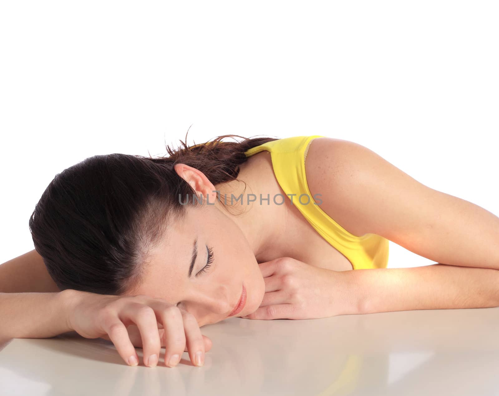 Attractive young woman taking a nap. All on white background.