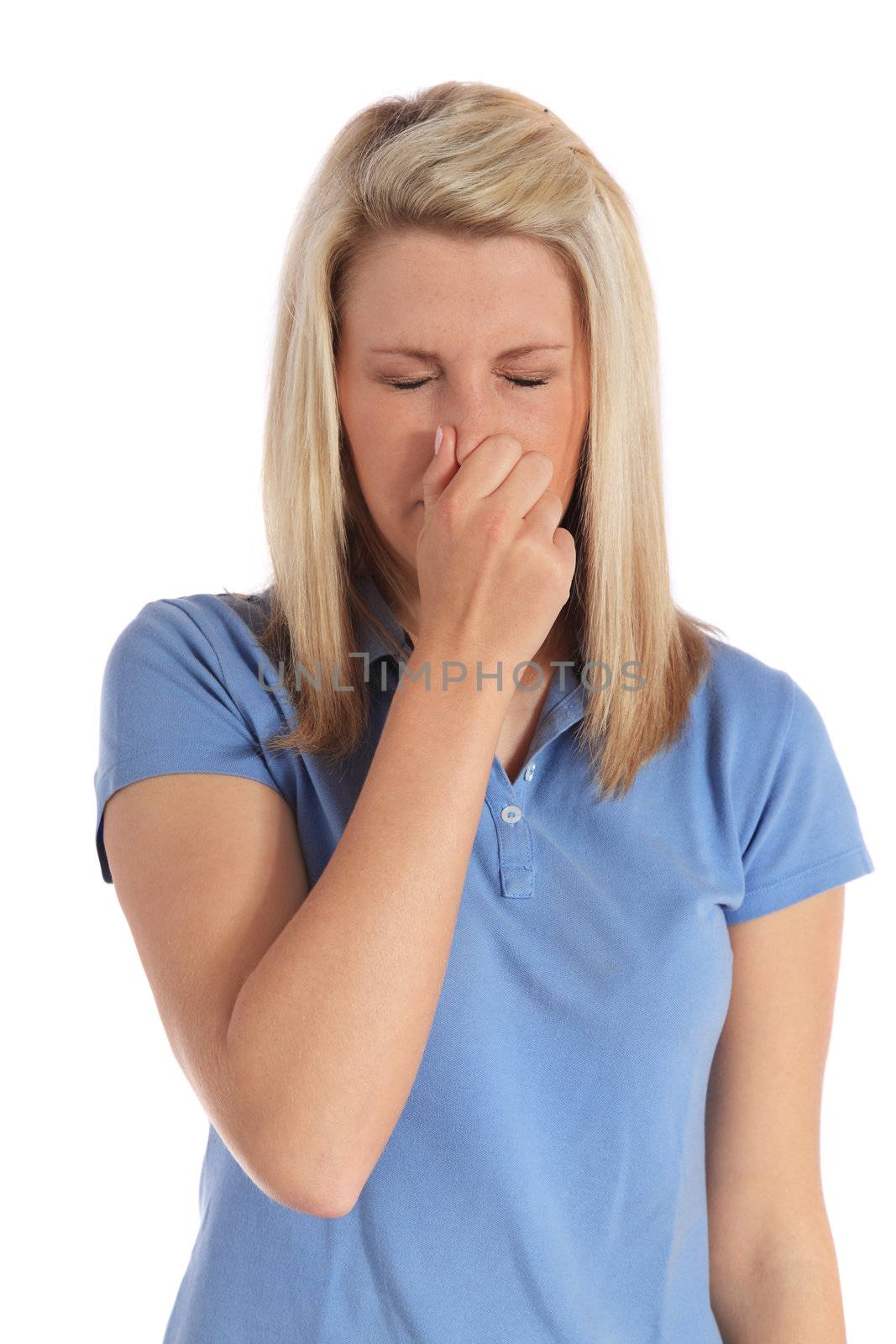 An attractive young woman sneezing. All on white background.