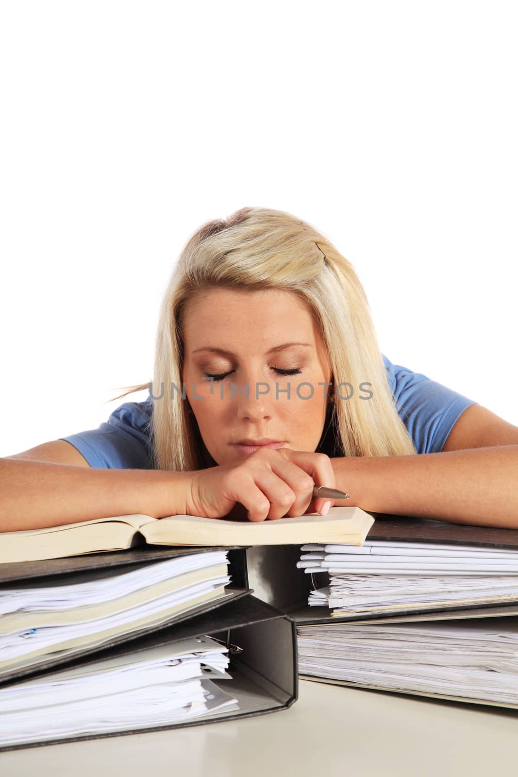 Attractive young student taking nap on her documents. All on white background.