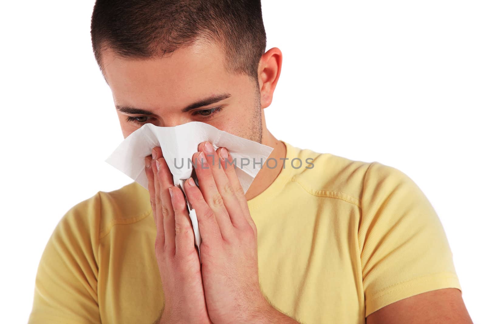 Attractive young man got a cold. All isolated on white background.