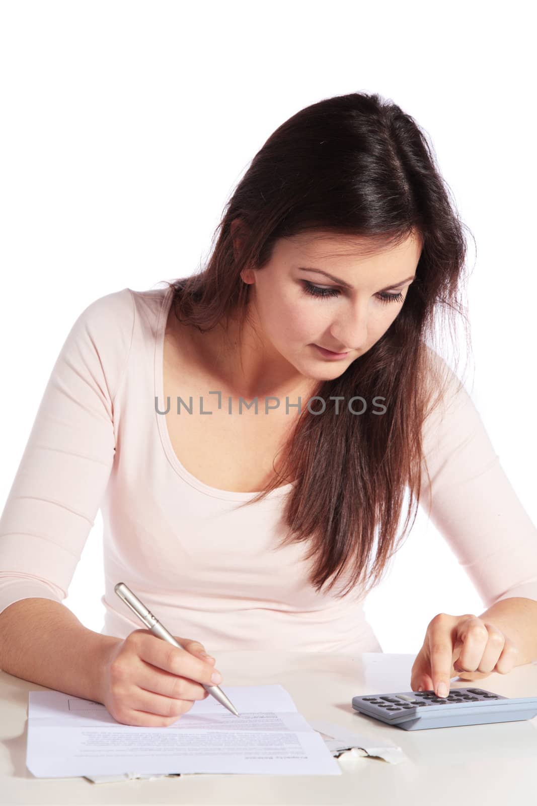 Attractive young woman crunching numbers.