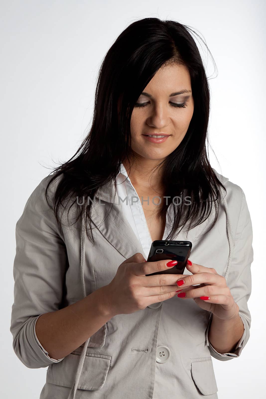 Image of young pretty people receiving SMS on your mobile phone