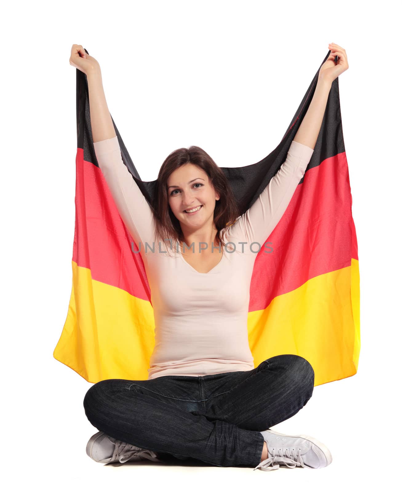 Attractive young woman holding a german flag. All on white background.