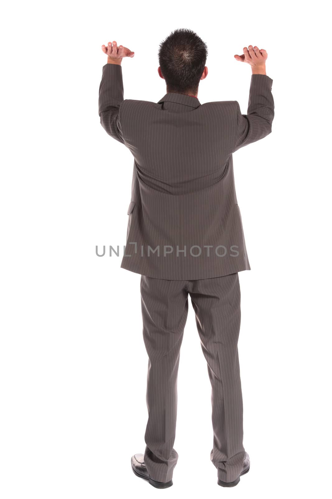 Backview of a businessman lifting his arms. extra copy space. All on white background.