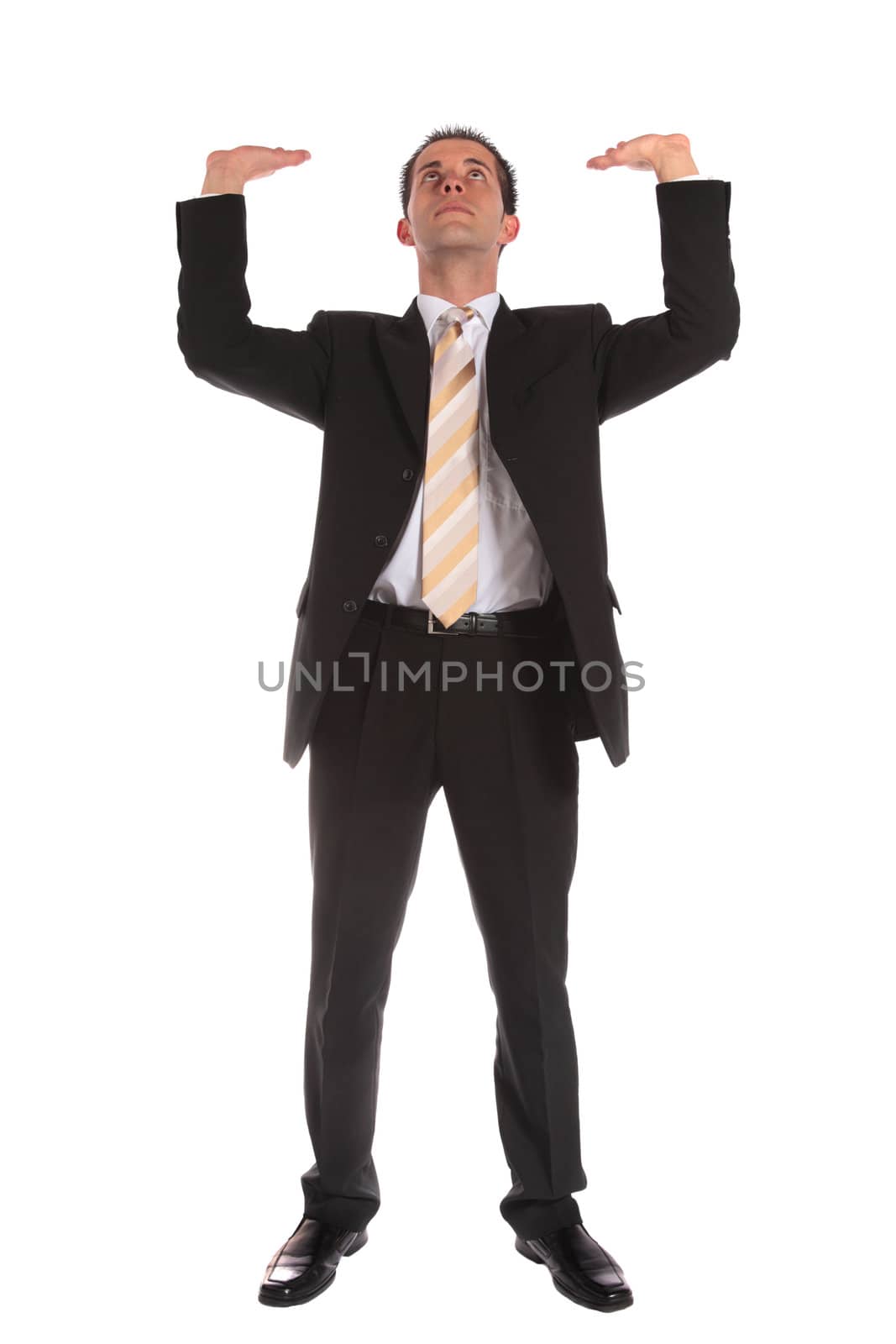 Businessman lifting his arms by kaarsten