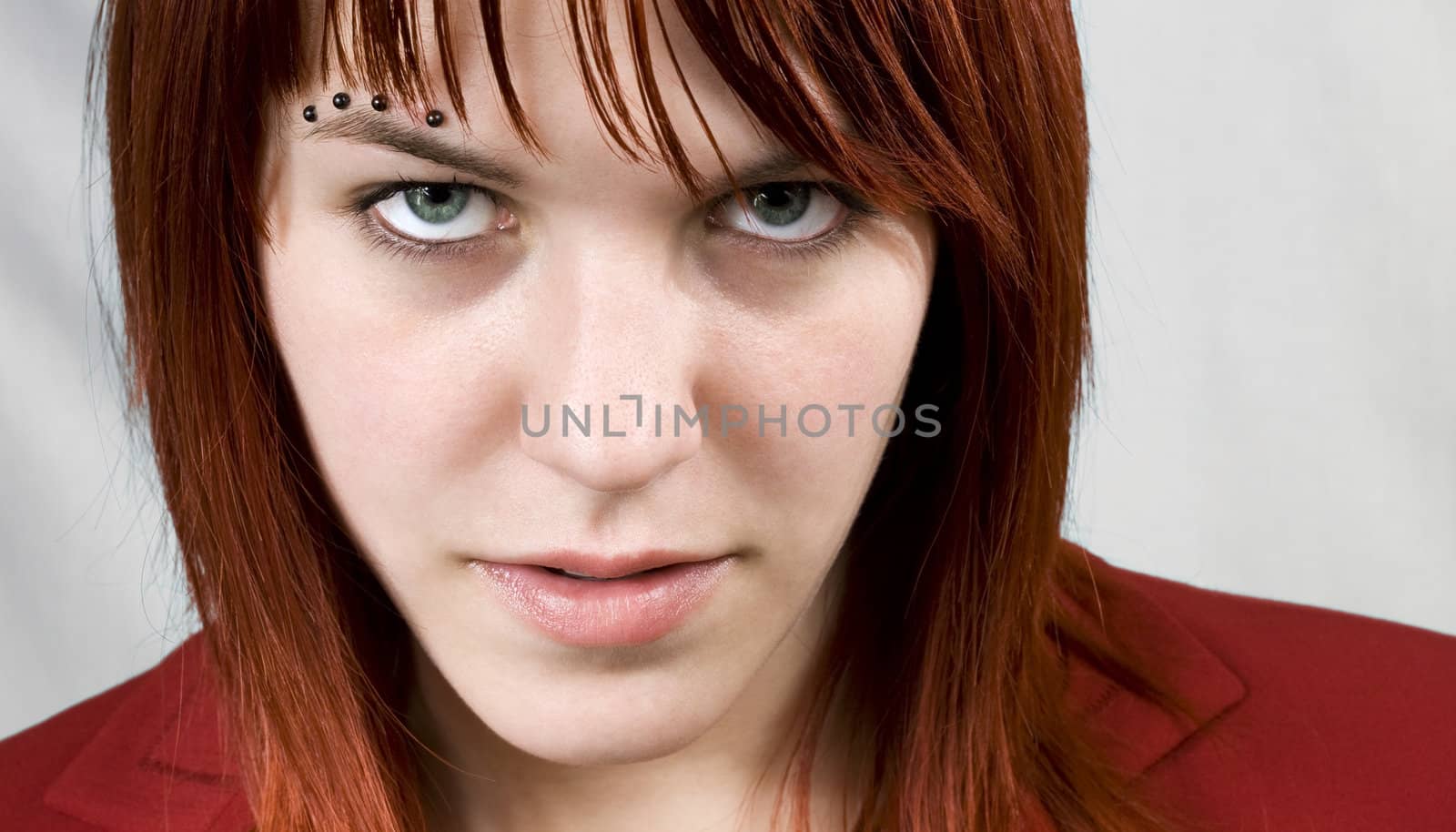 Aggressive girl staring at camera by domencolja