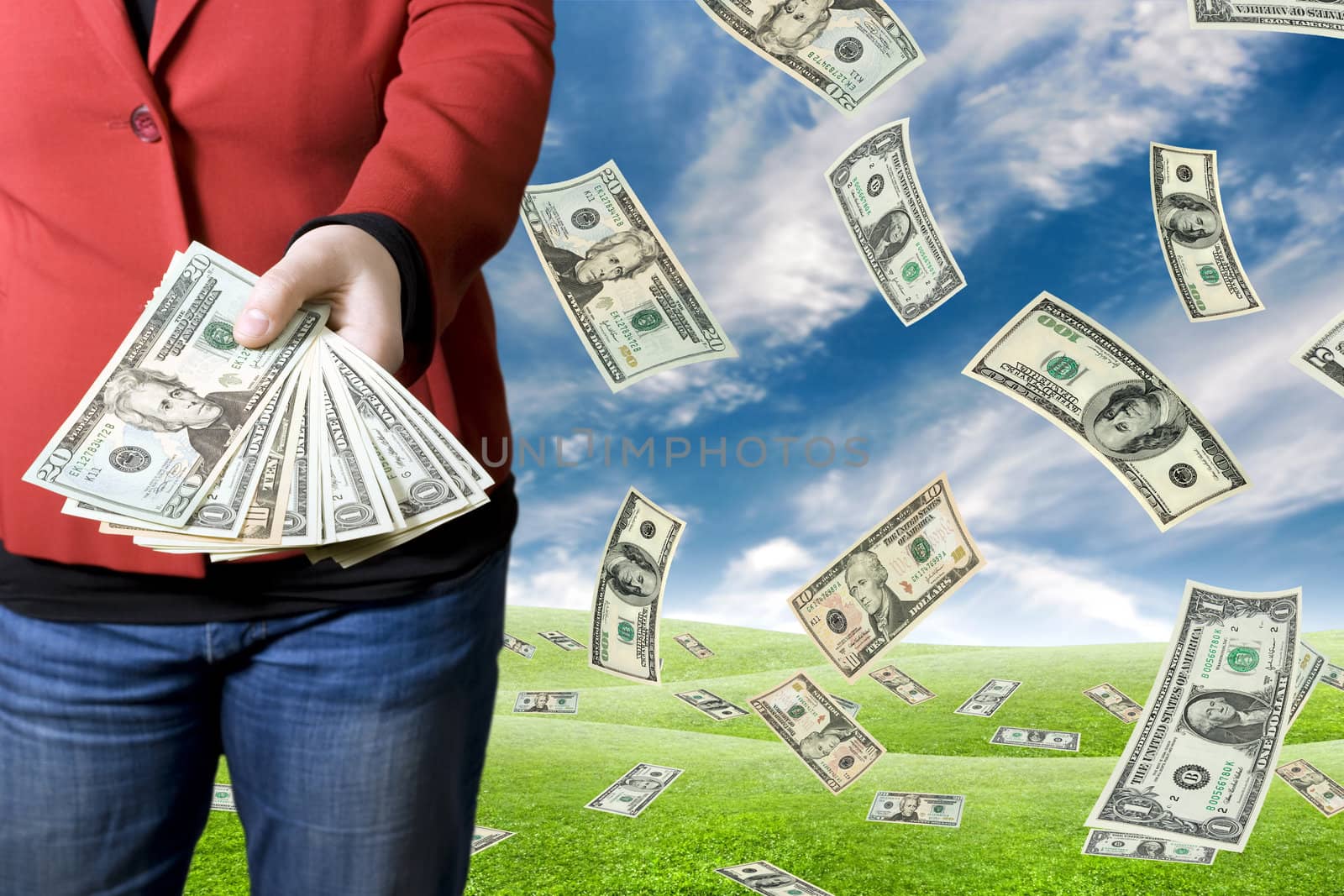 Girl dressed in a red dress and jeans picking up money falling from the sky and showing it.

Studio shot and composite.