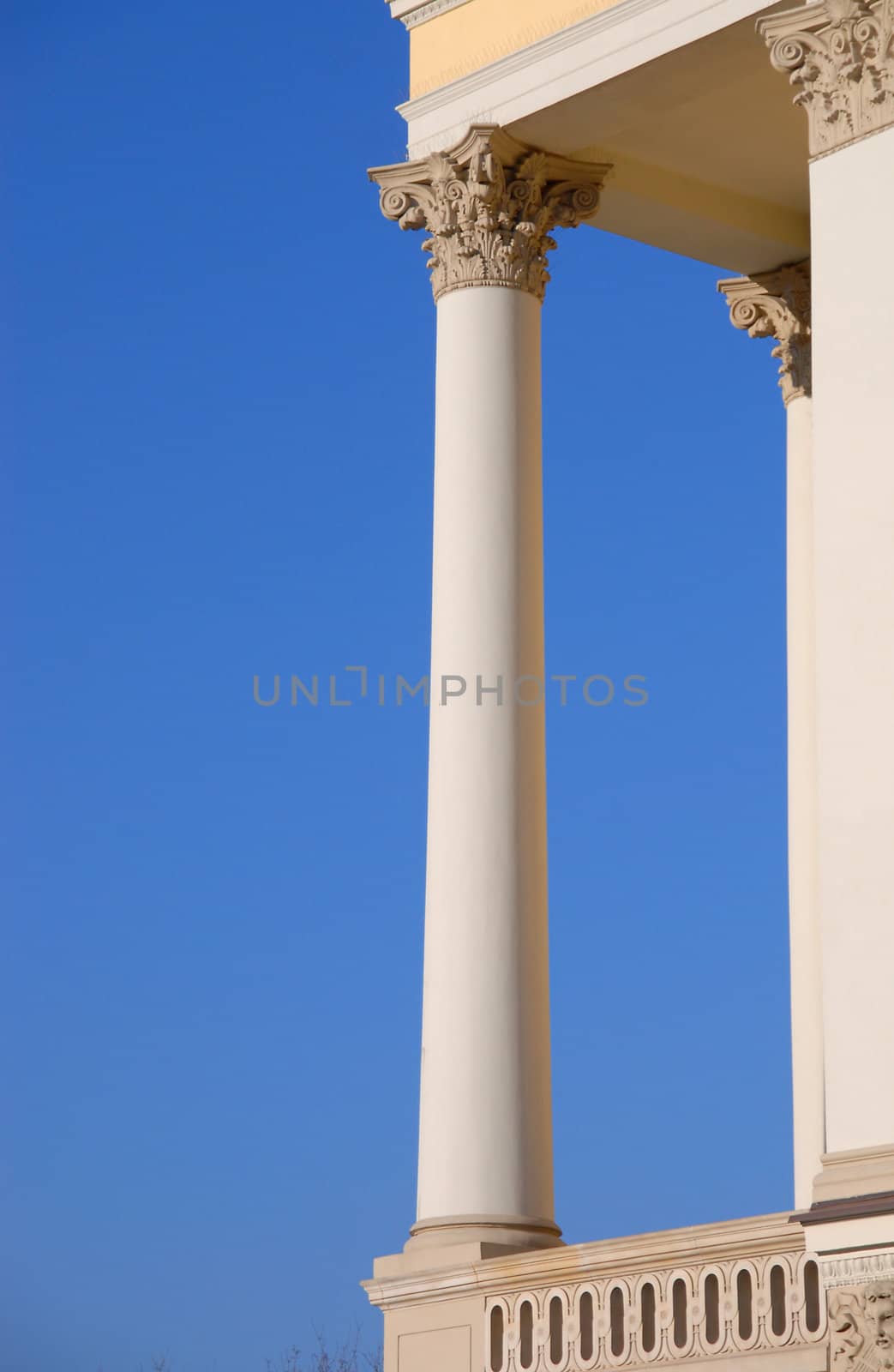 Ancient column on a blue background. by wojciechkozlowski